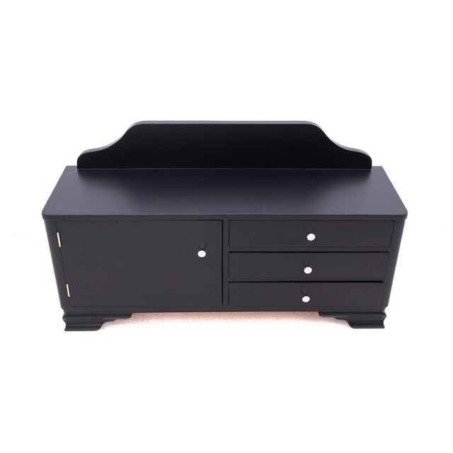 Chest of drawers from the mid-20th century, Poland. The chest of drawers has three drawers on the right side and one...