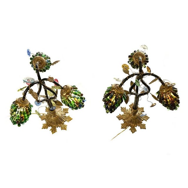 Three-light Murano lamps in gilt bronze and black metal; the Murano glass shades resemble bunches of grapes. Vintage Art...