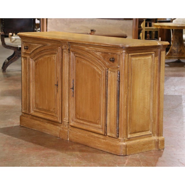 This robust mid-century "Buffet de Chasse" was crafted in France circa 1950 in the stately Louis XIV style, combining bold...