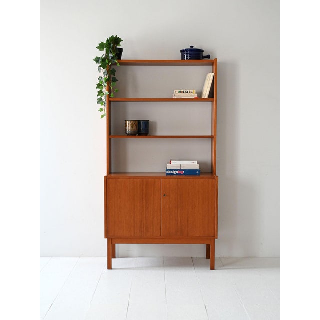 1950s/60s teak bookcase with hinged doors, adjustable shelves, and original key included. Vintage Scandinavian teak...