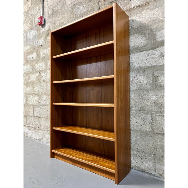 Vintage Mid Century Modern Danish Bookcase with Adjustable Shelves. Circa 1970s Features a modern Scandinavian minimalist...
