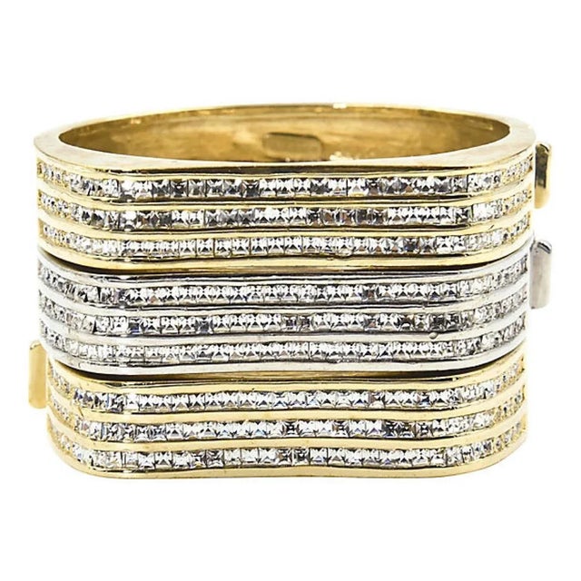 Beautifully made Italian bangle bracelets featuring three rows of crystals across the front of each bracelet. The front...