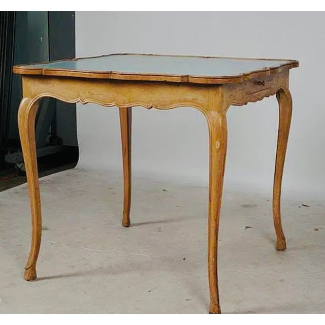 A one-of-a-kind French Louis XV–style game table, newly customized with an exceptionally beautiful powder-blue leather...