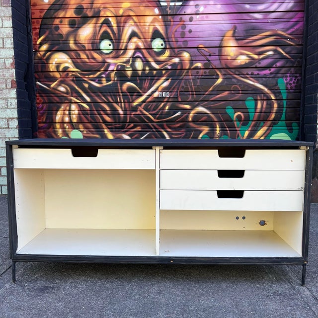 Paul McCobb for Planner Group credenza that sits atop iron legs. This piece fell in to the hands with someone with a...