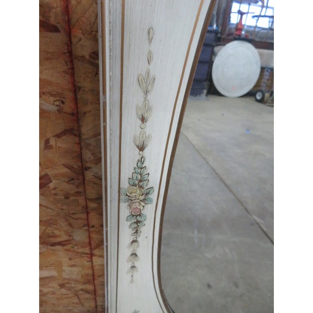 Hand painted Italian style mirror with a cream base color with all over floral decoration and painted brass rosettes in...