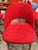 Upholstered in Knoll Classic Boucle in Crimson over a molded reinforced polyurethane back shell and contoured plywood...