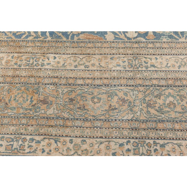 Representing the best of Khorassan, a legendary Persian weaving center, this genuine antique rug highlights the countrys...
