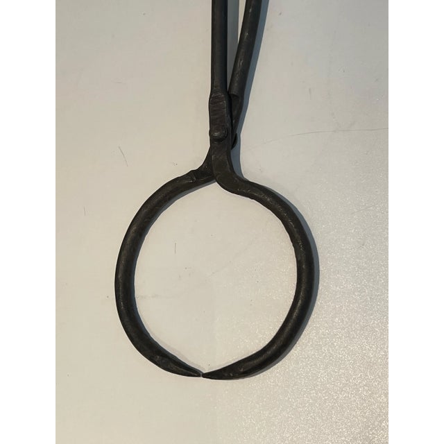 These stylished deerheads fireplace tools on stand are made of wrought iron. This is a French work in the style of Edouard...