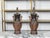 A pair of Asian bronze urn-shaped table lamps from the mid 20th century, with brown and black patina, mythical animals...