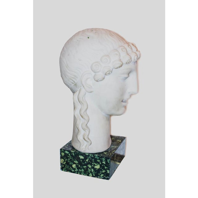Marble sculpture representing two Kore’s head with a serpentine marble bottom. Both signed behind the head by D’Antino....