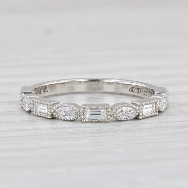 Gemstone Information: - Natural Diamonds - Total Carats - 0.37ctw Cut - Marquise 0.25ctw, Baguette 0.12ctw Color - G - H...