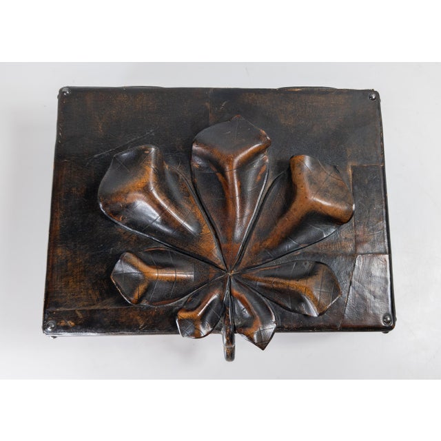 We are selling this really cool and interesting Folk art style leather box. This leather box appears to be mid to late...