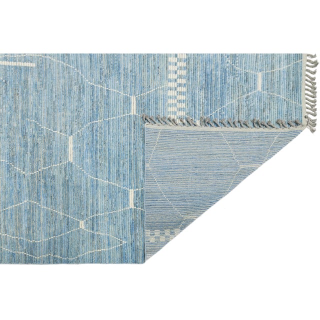 Elevate your contemporary interior with this exquisite Modern Moroccan style wool rug. Masterfully hand-knotted by skilled...