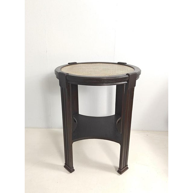Beautiful side table made of high-quality solid oak with a dark finish. Features a striking, textured polished brass inlay...