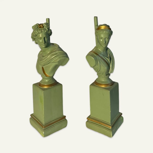 Pair of neoclassical green painted plaster lamps, one depicting the bust of a man, the other the bust of a woman. Possibly...