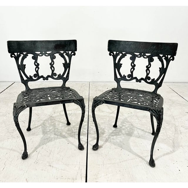 Mid century cast aluminum dining set, made by Molla. Eight klismos style side chairs with cabriole legs and matching...