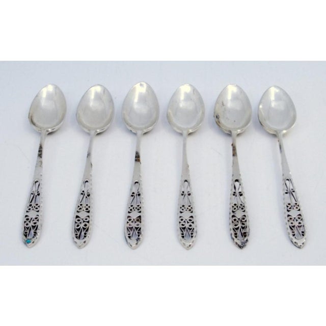 Silver Coffee Spoons with Filigree Cut Handles, Set of 6, in Very Good conditions. Designed from 2000 This piece has an...