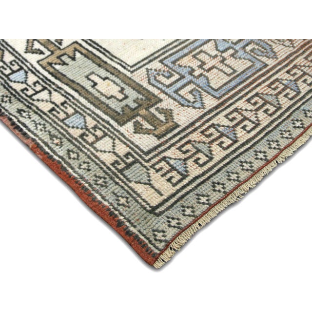 This vintage Turkish Oushak Runner is an exquisite piece of art crafted with wool on wool. Boasting a vibrant and...