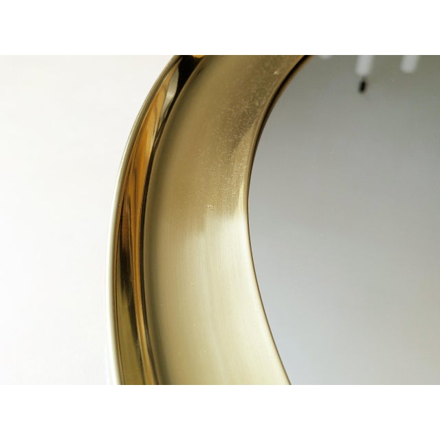 Large wall mirror with concave polished brass frame and painted aluminum structure Pretty good vintage condition: Overall...