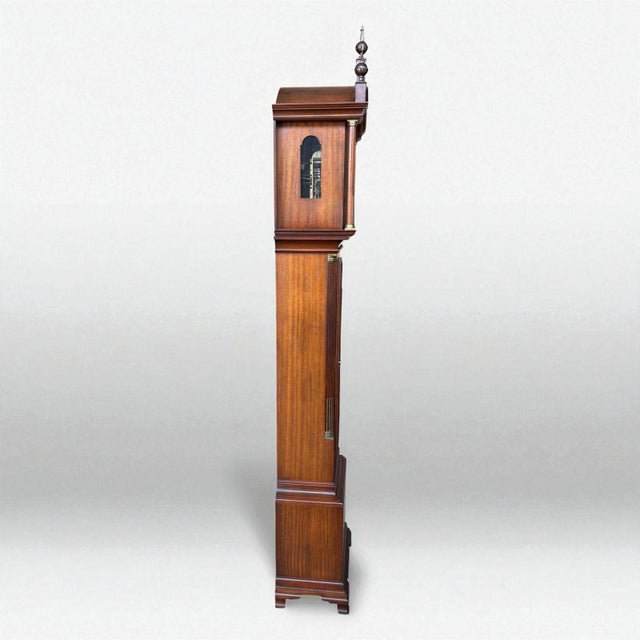 A striking collectors piece from the Mod 20th Century. This grandfather clock is an exquisite example of early American...
