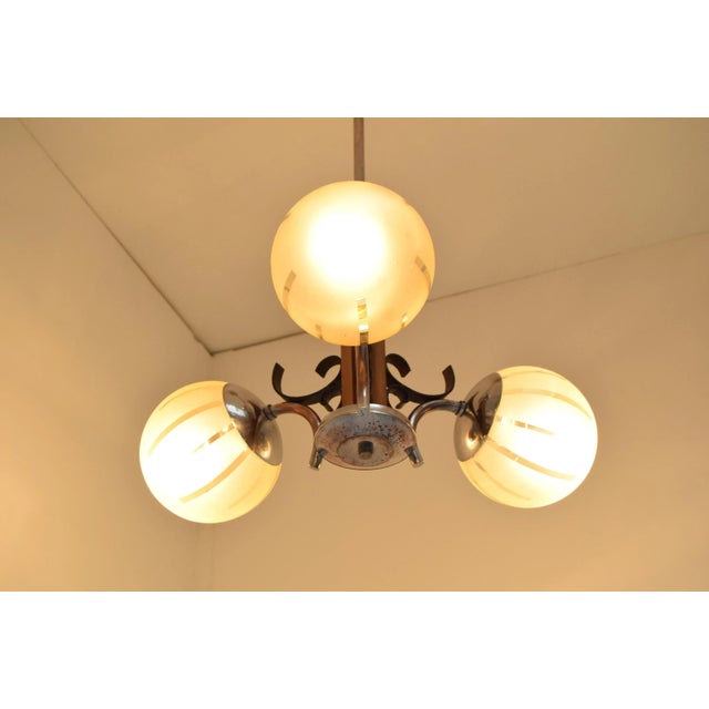 Made in Czechoslovakia Made of glass, wood, chrome With aged patina 3xE27 or E26 socket Re-polished Original condition. Up...