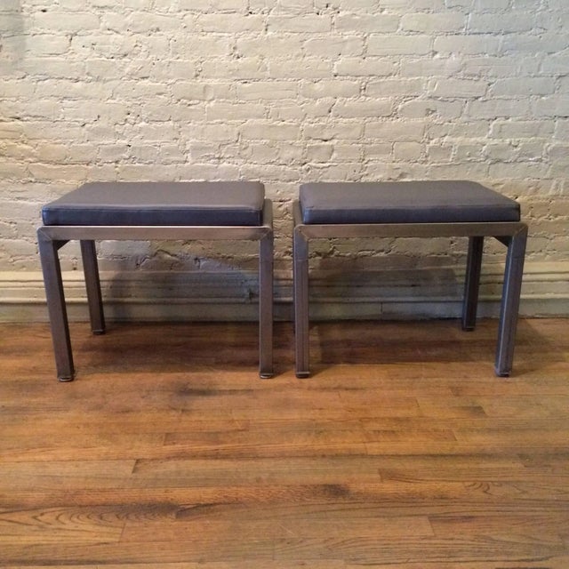 Pair of Art Deco ottomans or stools by Norman Bel Geddes for Simmons furniture company are brushed steel with newly...