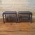 Pair of Art Deco ottomans or stools by Norman Bel Geddes for Simmons furniture company are brushed steel with newly...