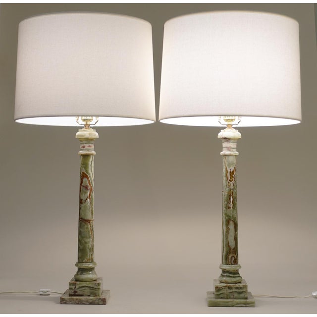 A striking matching set of large Italian Onyx marble Classic Hollywood Regency Tuscan Column style table lamps from Italy...
