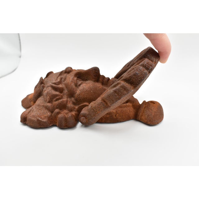 This is the an adorable door knocker! It is cast iron in a classic design. It is European from the 21st Century.