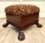 Here is a vintage circa mid-century Chippendale style ottoman with a beautifully detailed wood base, dramatic carved paw...