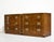 A striking pair of 1970s campaign chests by Hickory Furniture, these solid wood nightstands showcase beautiful burl wood...