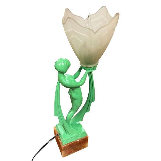 French Art Aeco “Limousin” figural nude Lamp, circa 1930 with a frosted tulip shade, and onyx marble base. A striking...