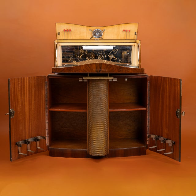 A Mid-Century Modern style bar cabinet, manufactured in London during the 1950s by the prestigious firm Rivington...