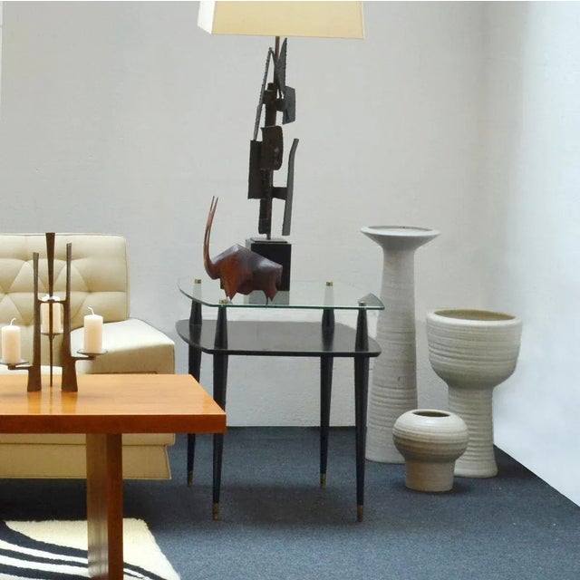 Three tall and turned studio pottery floor vases with chalk white glaze., Dutch 1970-80s The tallest is in elongated form...