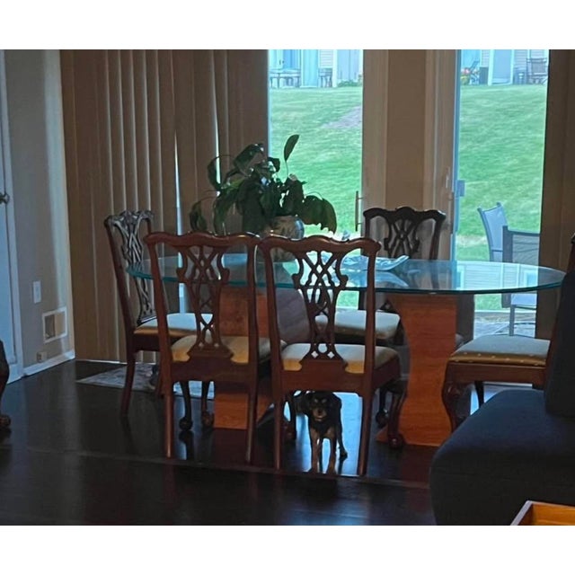 Elegant vintage 9-piece dining set featuring a large oval glass-top table and eight matching E.J. Victor dining chairs....