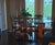Elegant vintage 9-piece dining set featuring a large oval glass-top table and eight matching E.J. Victor dining chairs....