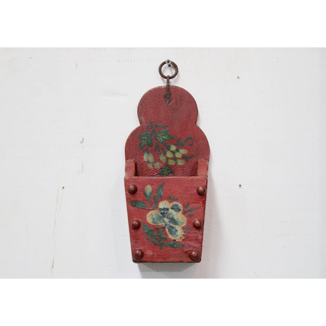 Our wall pocket has a curved back with painted blossoms. Rich warm tones red, forest green, cream, and white. Hang...