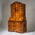 Baroque secretary with three drawers and a serpentine front, featuring a fall-front writing surface and an upper...