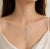 Art Deco Late 20th Century 14K 2 Tone White Rose Gold Diamond Oriental Station Necklace For Sale - Image 3 of 3