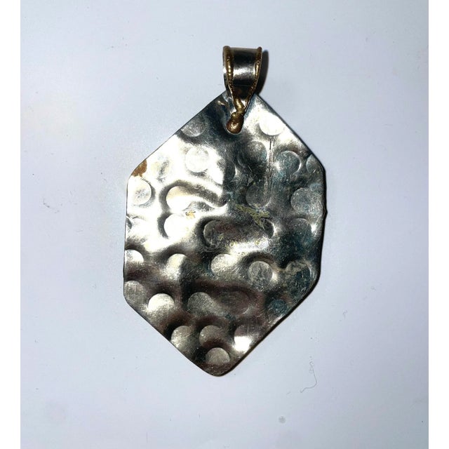 This is part of Chairish’s Costume Jewelry assortment. This hexagonal oversized pendent of hammed silver and copper with...
