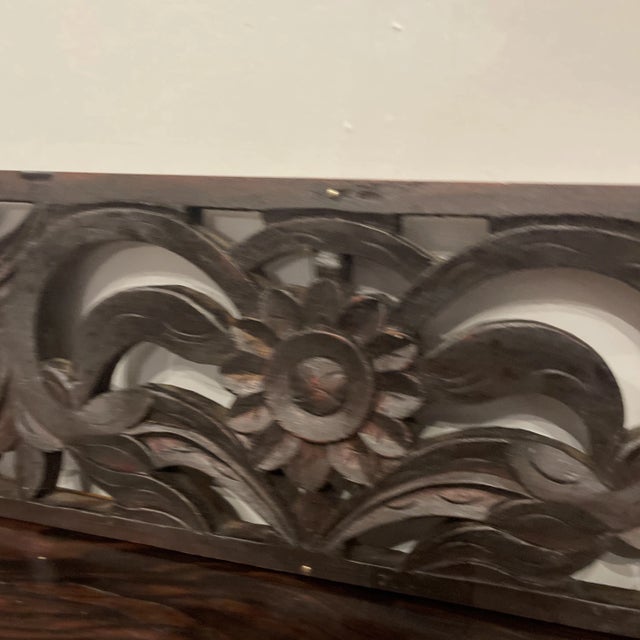 Hand carved wood rectangular fragment. Scrolled Foliate design with a central flower.