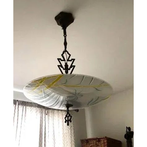 A fine French Art Deco style glass pendant chandelier. Epitomizing the cosmopolitan glamour, this five-light chandelier is...