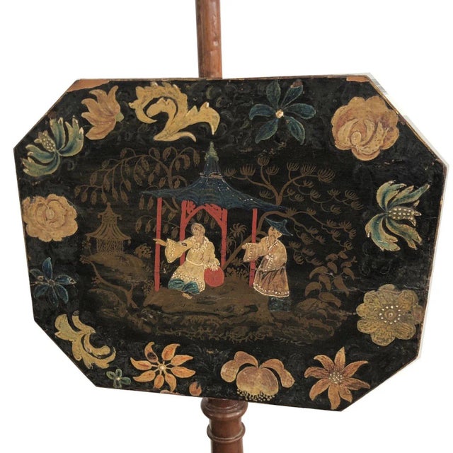 A fine and rare American Federal pole screen probably New England. The octagonal japanned screen is painted with a scenic...