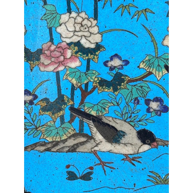 A bronze and cloisonné enamel round plate designed in Japan at the end of the 19th century, during the 'Meiji' era, which...