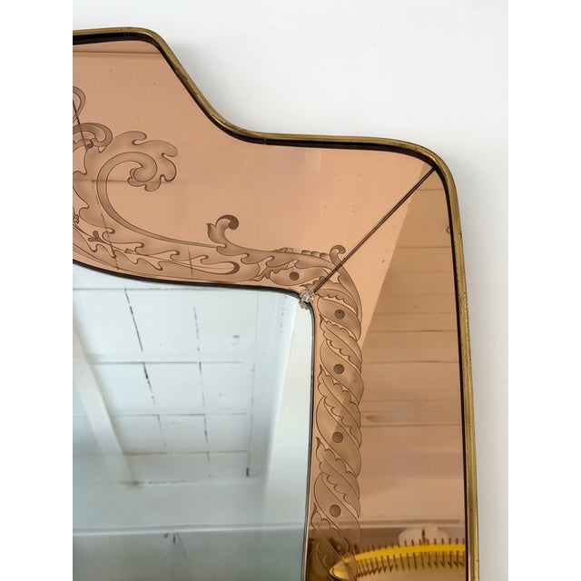 Rare wall mirror by the italian design manufacture artist Giovanni Battista Gariboldi. Brass and pink copper colored...