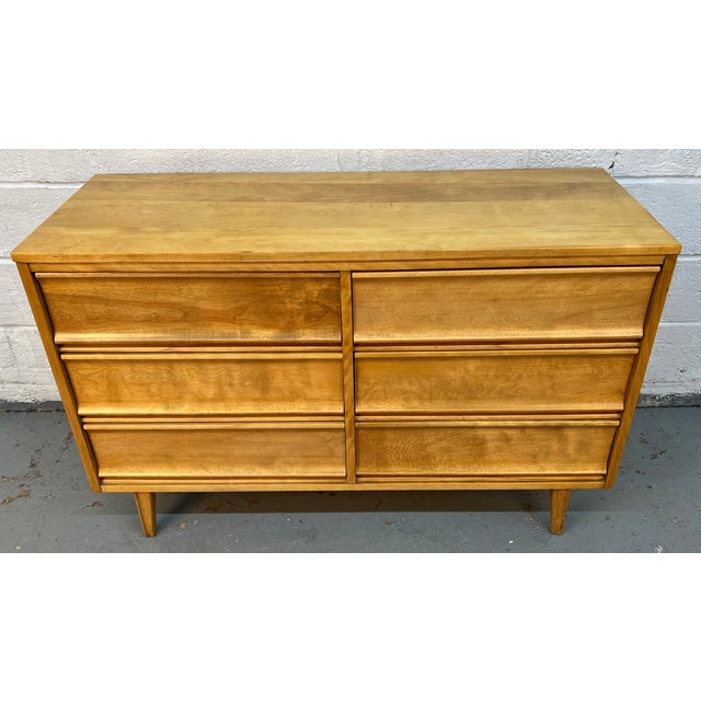 Bring refined simplicity and dependable craftsmanship into your space with this mid-century modern birch dresser by Morris...