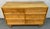 Bring refined simplicity and dependable craftsmanship into your space with this mid-century modern birch dresser by Morris...