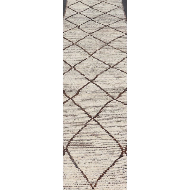 Variegated white and off white background along with brown diamond shaped lines creates tribal design, modern design...