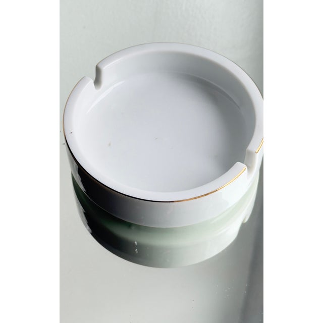 This is a curated mixed set of vintage porcelain “smalls” for tabletop use. The four floral Rococo coasters are marked...