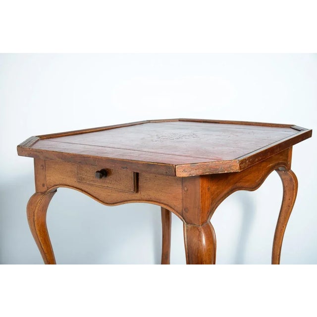 Just in, this wonderful French Louis XV, 18th C. Game Table With Original Red Leather Top This table is a rectangular...
